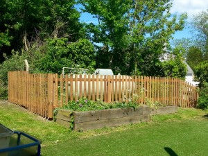 Picket fence protecting oil tank in a school